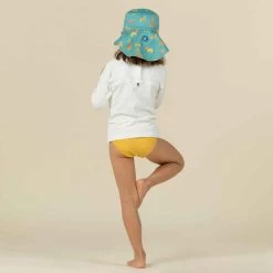 Chapeau Anti UV Bébé Réversible Jaune Et Bleu Imprimé SAVANE -Nager NABAIJI chapeau anti uv bebe reversible bleu et imprime palmiers 5